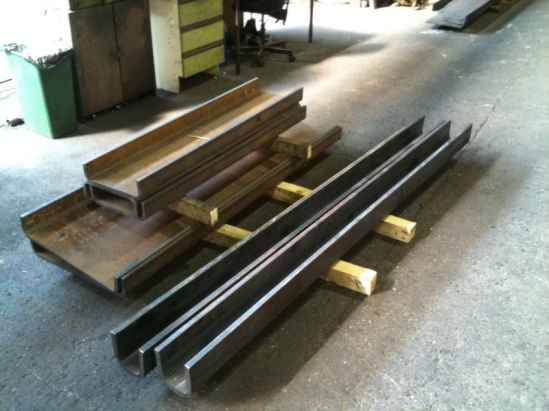 New tender drag box sections (on the left) and  loco front buffer beam backing pieces (right) awaiting collection from Accurate  Section Benders.  These need further fabrication work, machining and  drilling before assembly.... more on that soon hopefully.